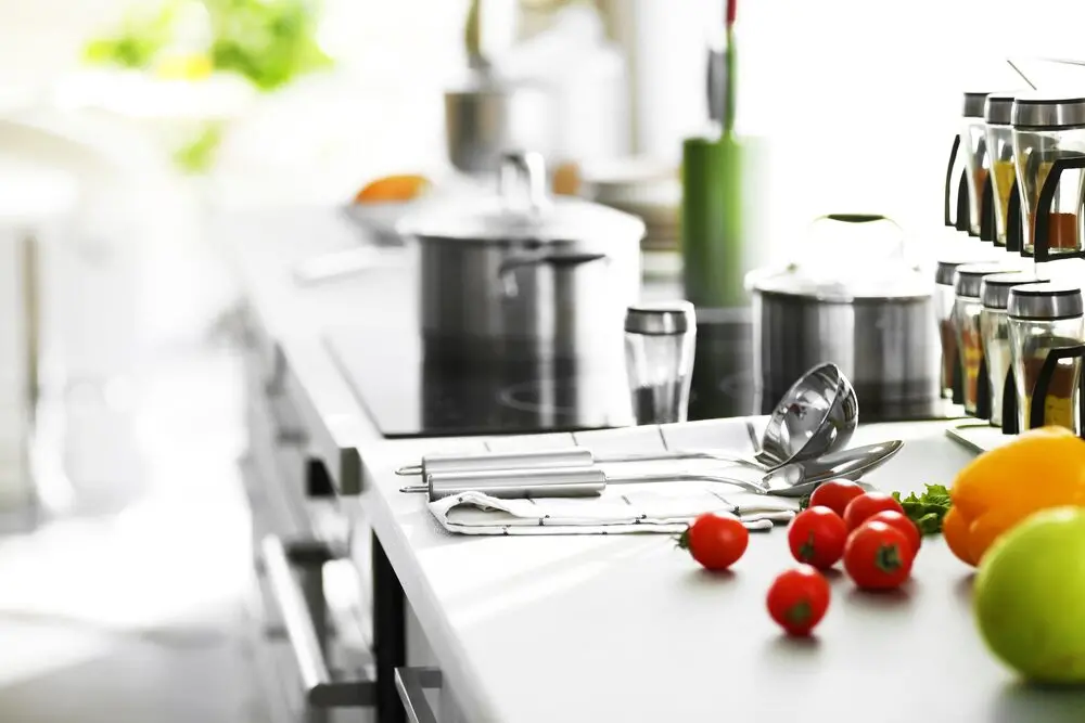 How to Design a Bright Kitchen with Black and Gray Quartz Countertops?